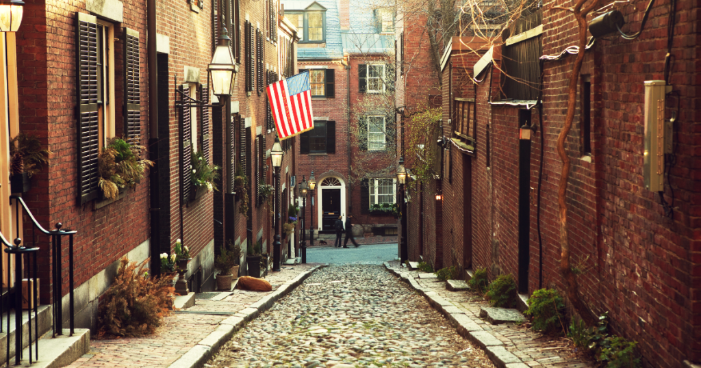 Boston cobblestone street with townhomes