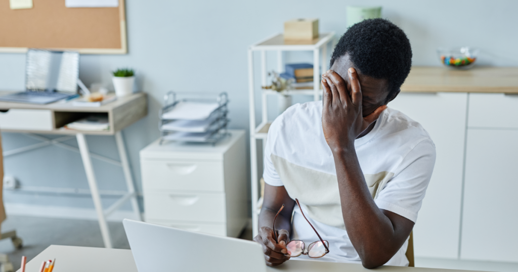 Man stressed at laptop