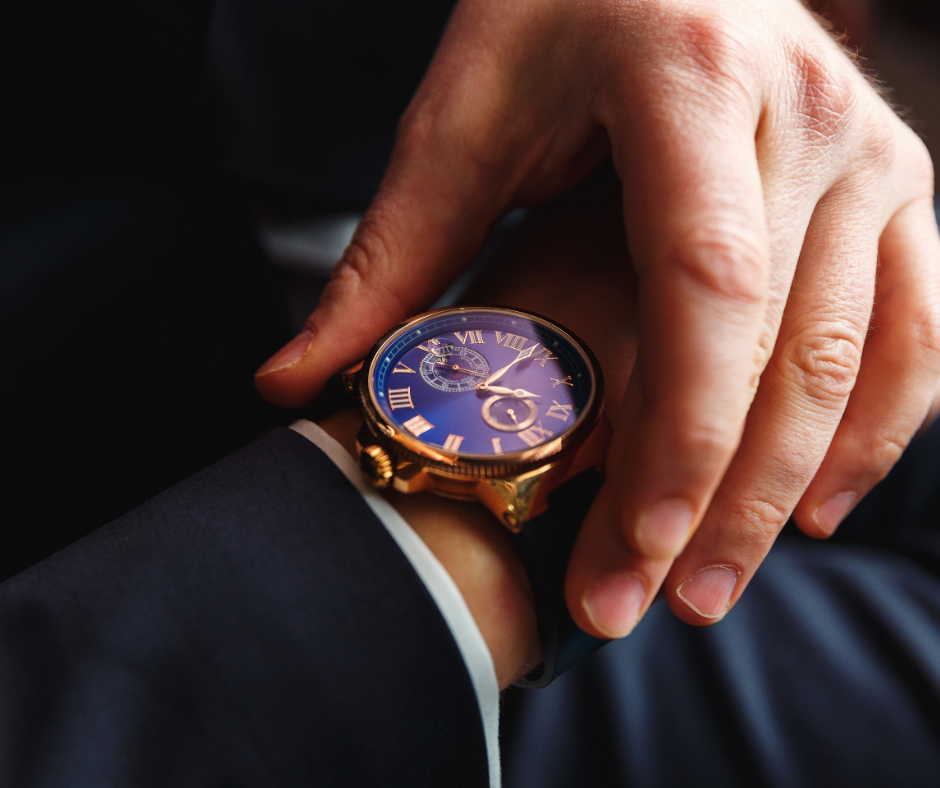 zoomed in watch on a businessperson wearing a suit