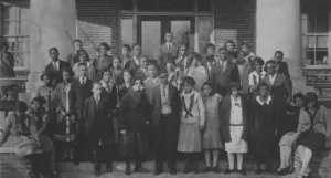 A group of students standing in front of the North Carolina College for Negroes circa 1920