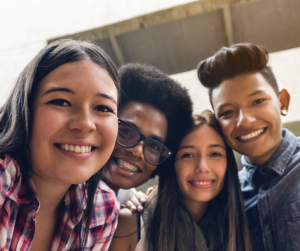 group of young people smiling and facing forward
