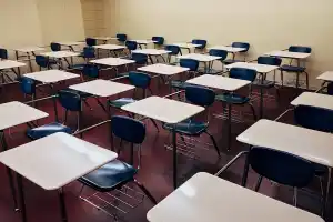 empty classroom with desks in rows