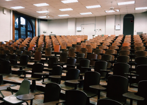 empty lecture hall with empty desks