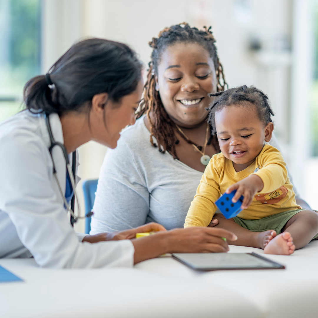 Photo of doctor and mom with child